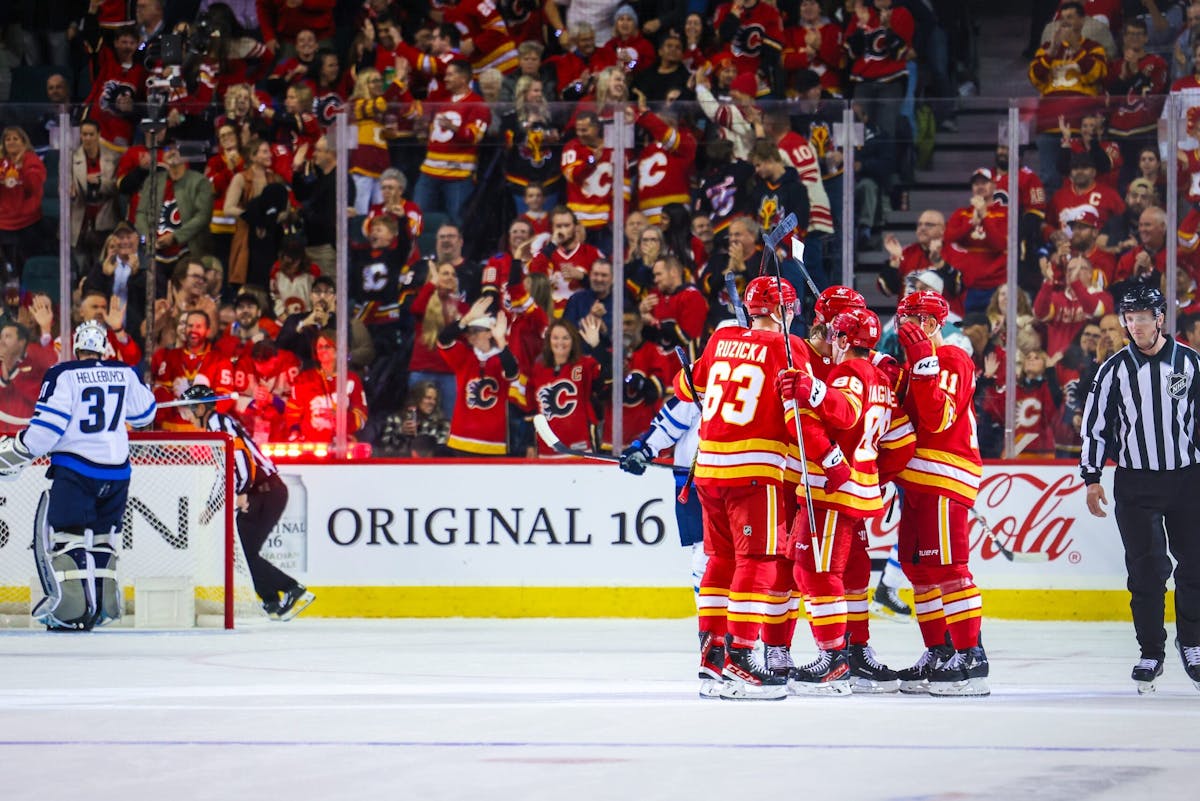 Andrew Mangiapane has 2 goals and an assist, Flames beat Jets 5-3 in opener