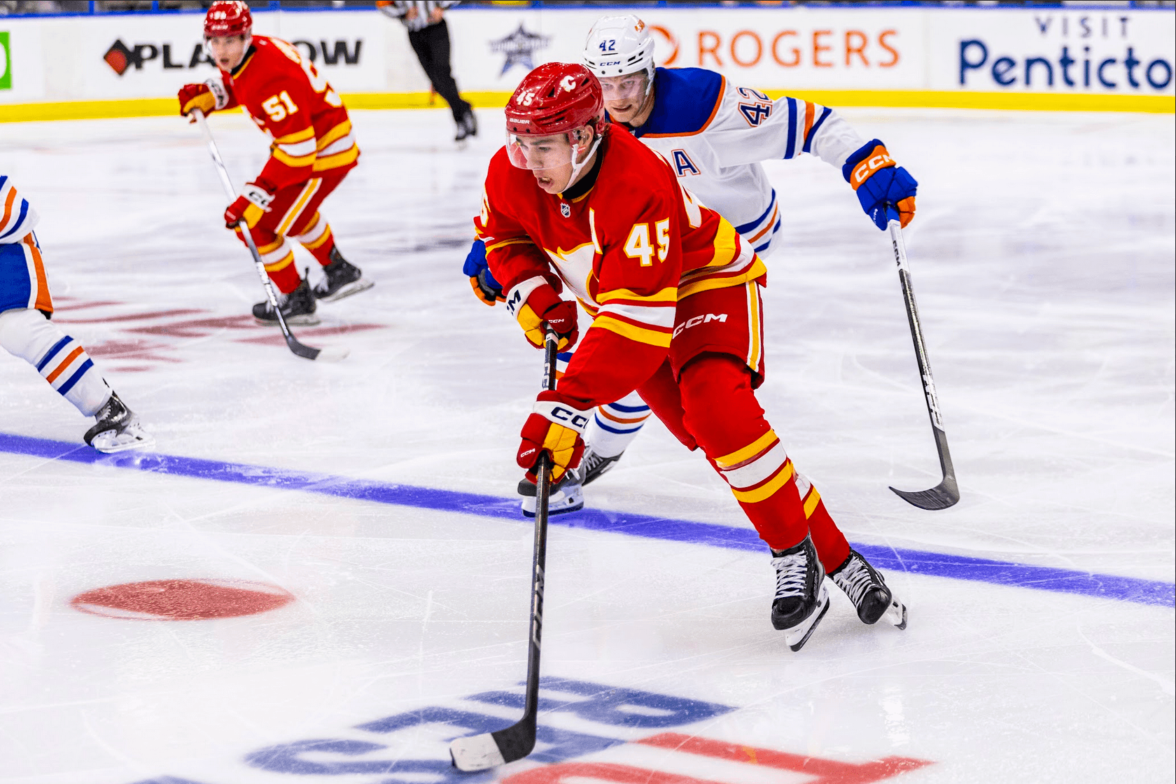 Sam Morton skates through the neutral zone in the Calgary Flames vs. Edmonton Oilers game at the 2024 Young Stars Classic in Penticton, BC.