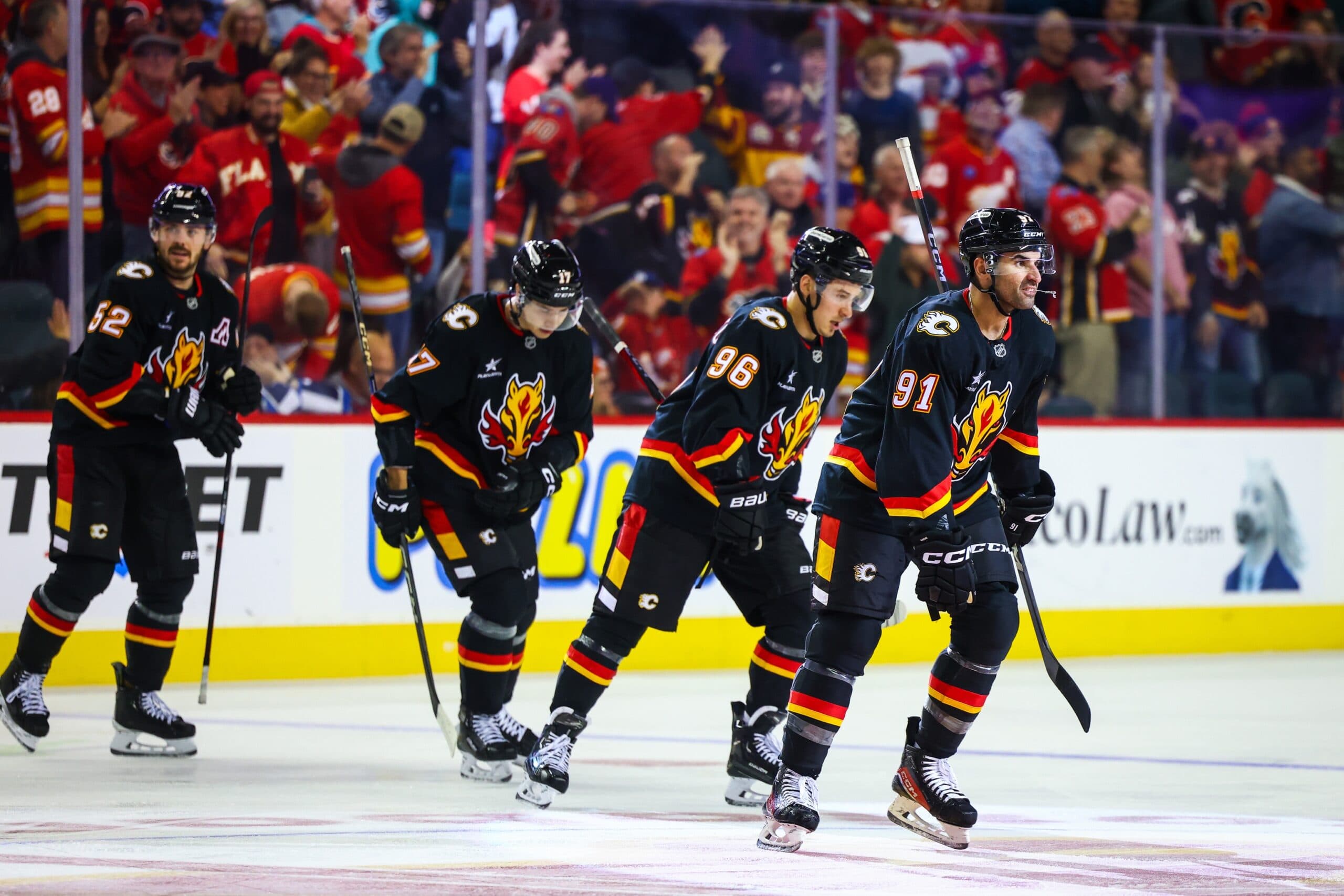 Calgary Flames center Nazem Kadri (91) celebrates his goal with teammates against the Winnipeg Jets during the third period at Scotiabank Saddledome.