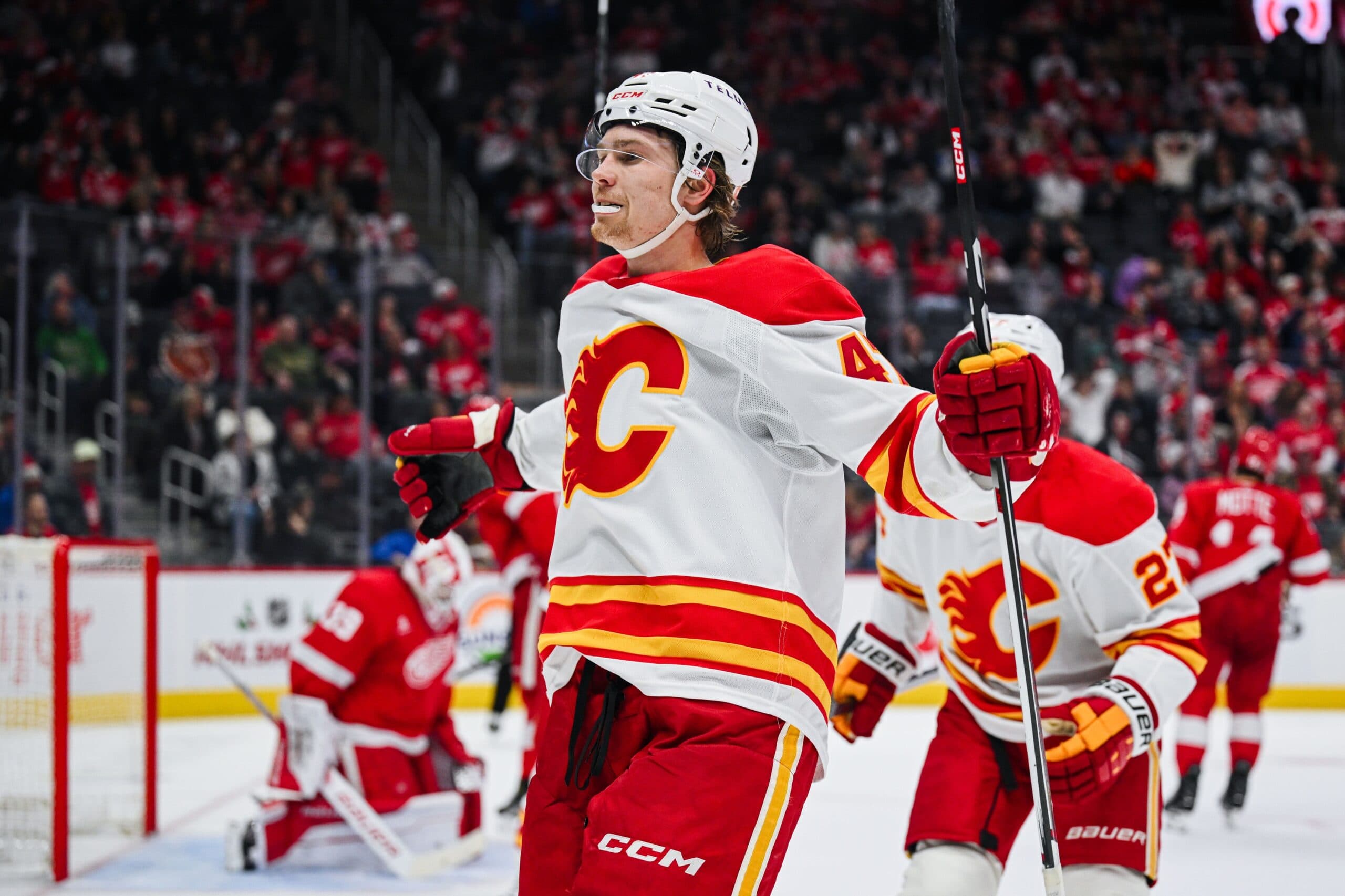 Calgary Flames center Connor Zary (47) celebrates after his goal during the third period against the Detroit Red Wings at Little Caesars Arena.