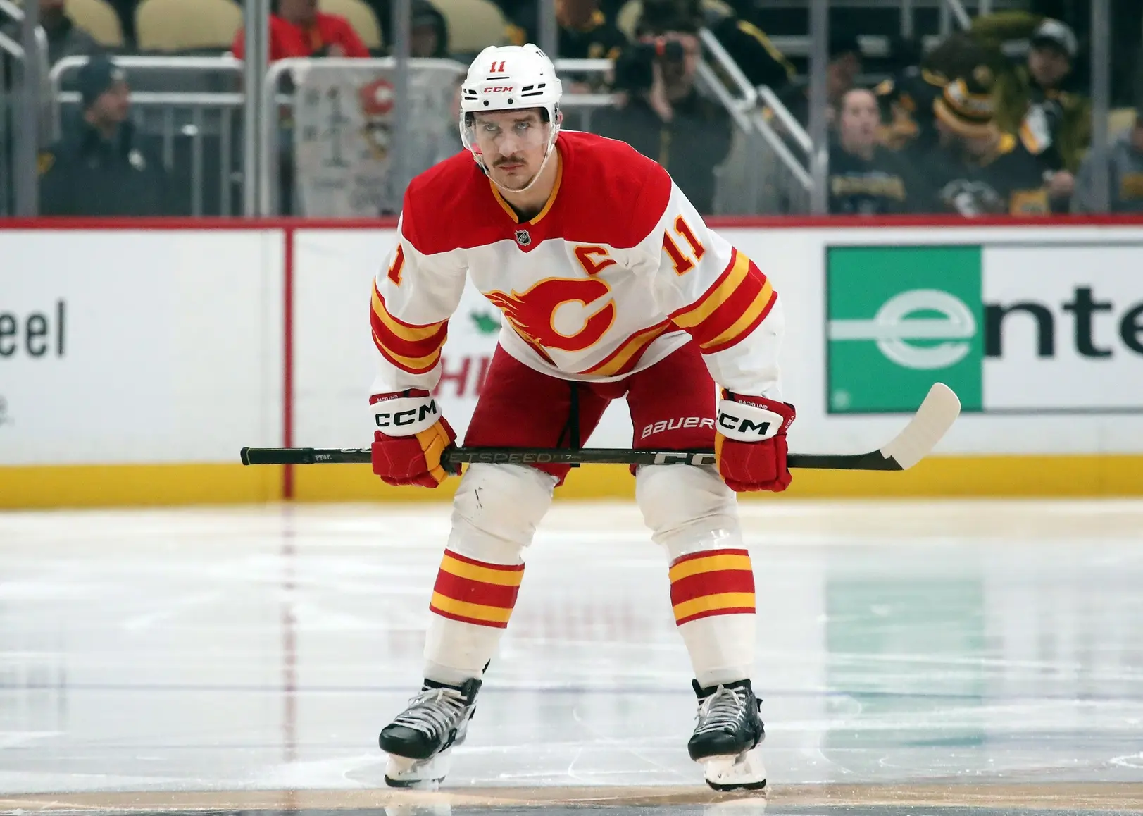 Calgary Flames center Mikael Backlund (11) waits to take a face-off to begin the second period against the Pittsburgh Penguins at PPG Paints Arena