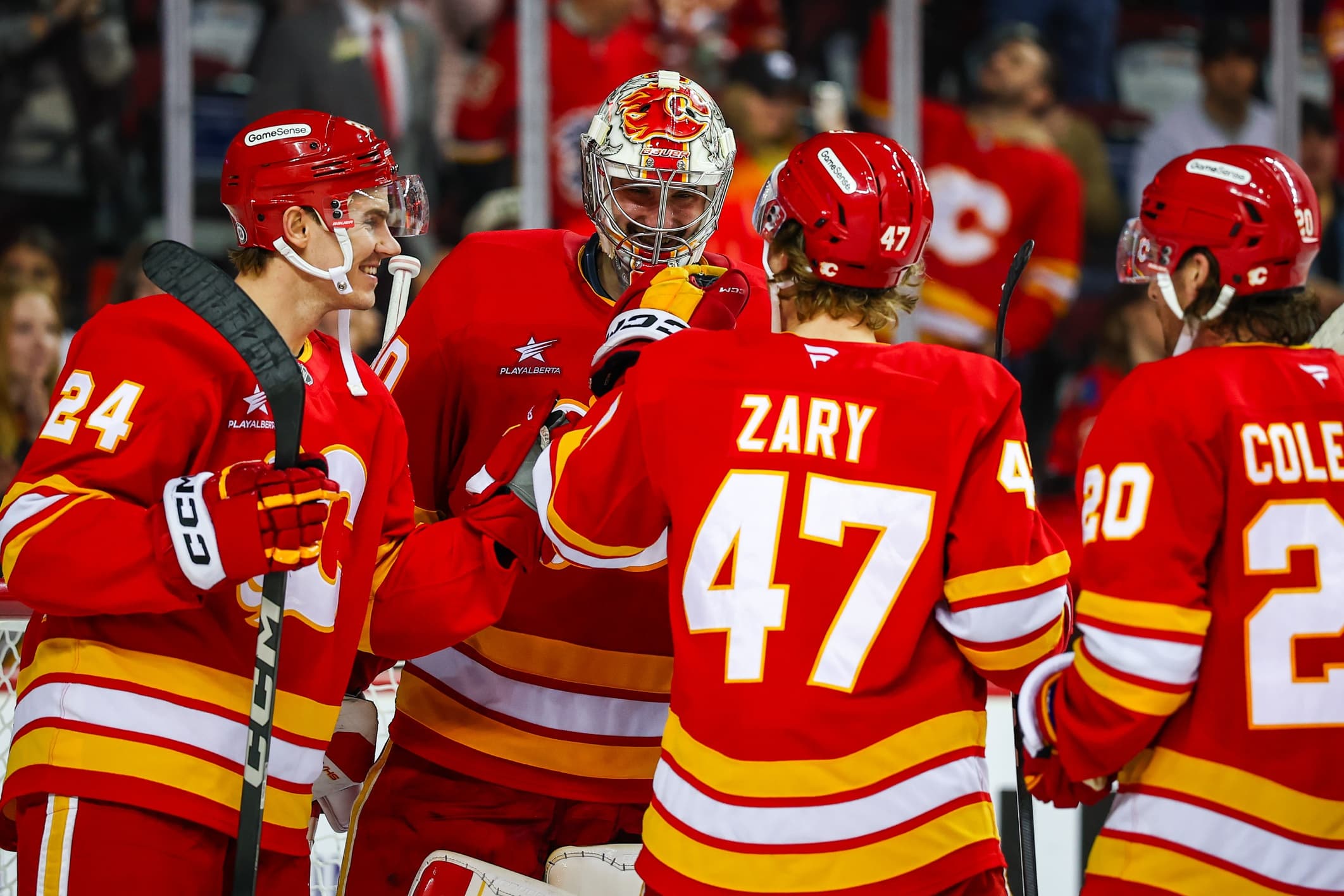 Calgary Flames goaltender Dan Vladar (80) celebrate win with teammates after defeating the Columbus Blue Jackets at Scotiabank Saddledome