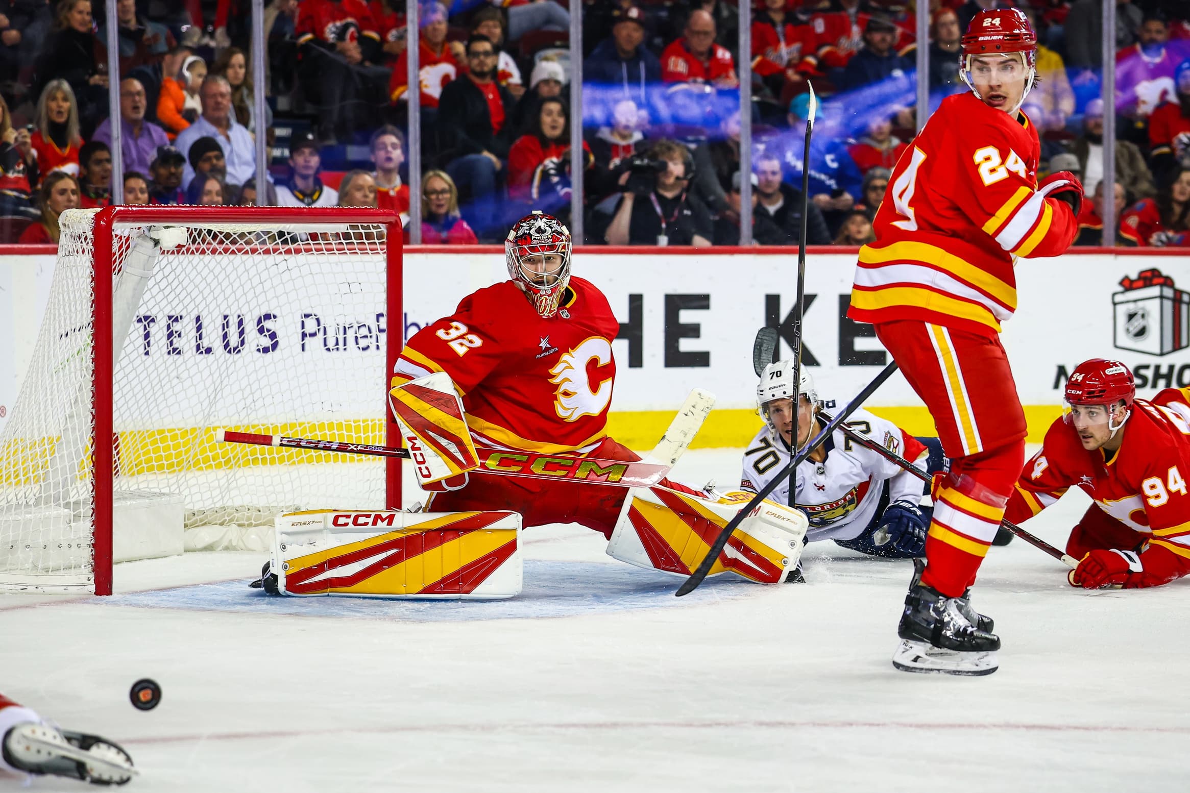 Calgary Flames goaltender Dustin Wolf (32) guards his net against the Florida Panthers during the third period at Scotiabank Saddledome.