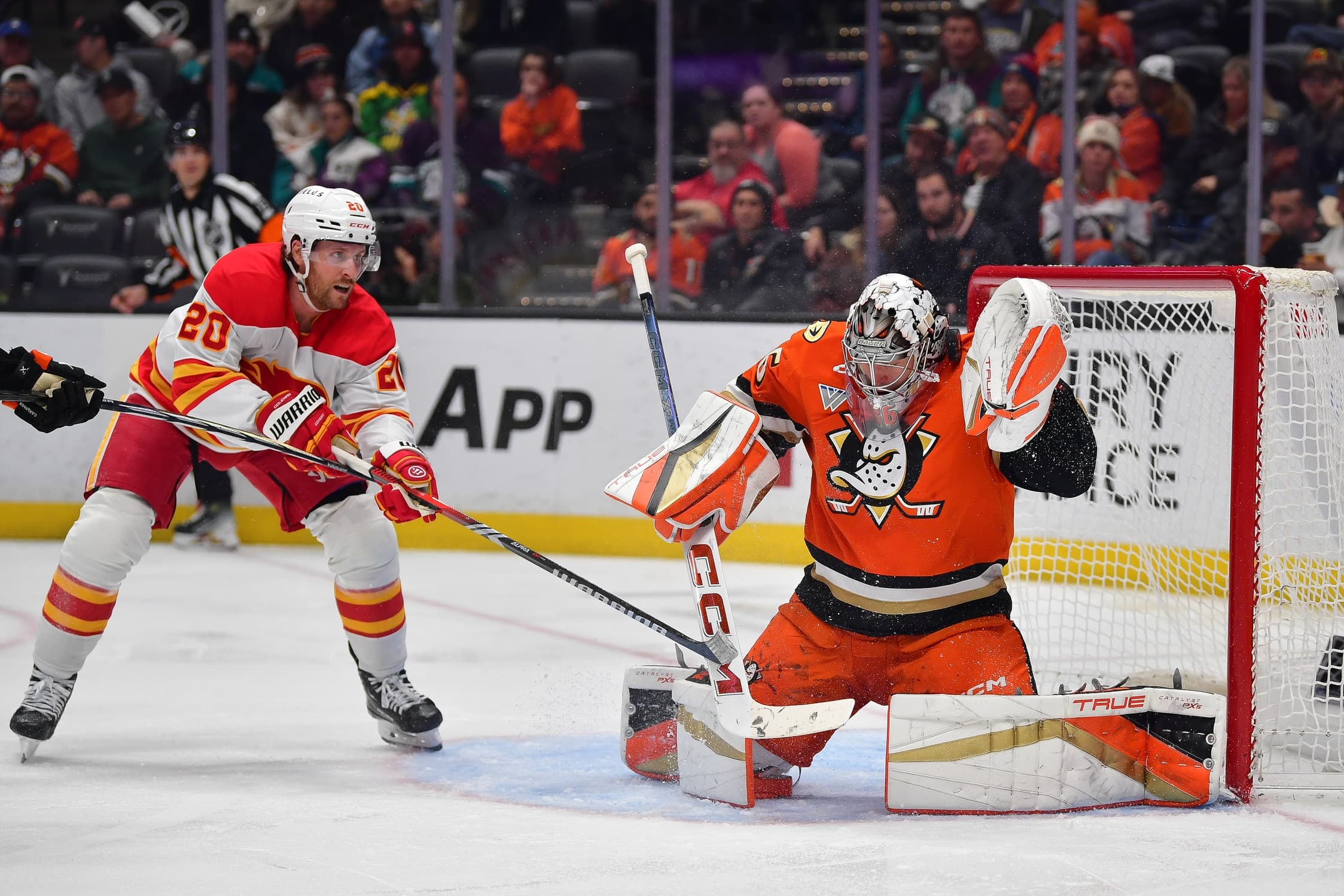 Anaheim Ducks goaltender John Gibson (36) blocks a shot as Calgary Flames center Blake Coleman (20) moves in for the rebound during the third period at Honda Center.