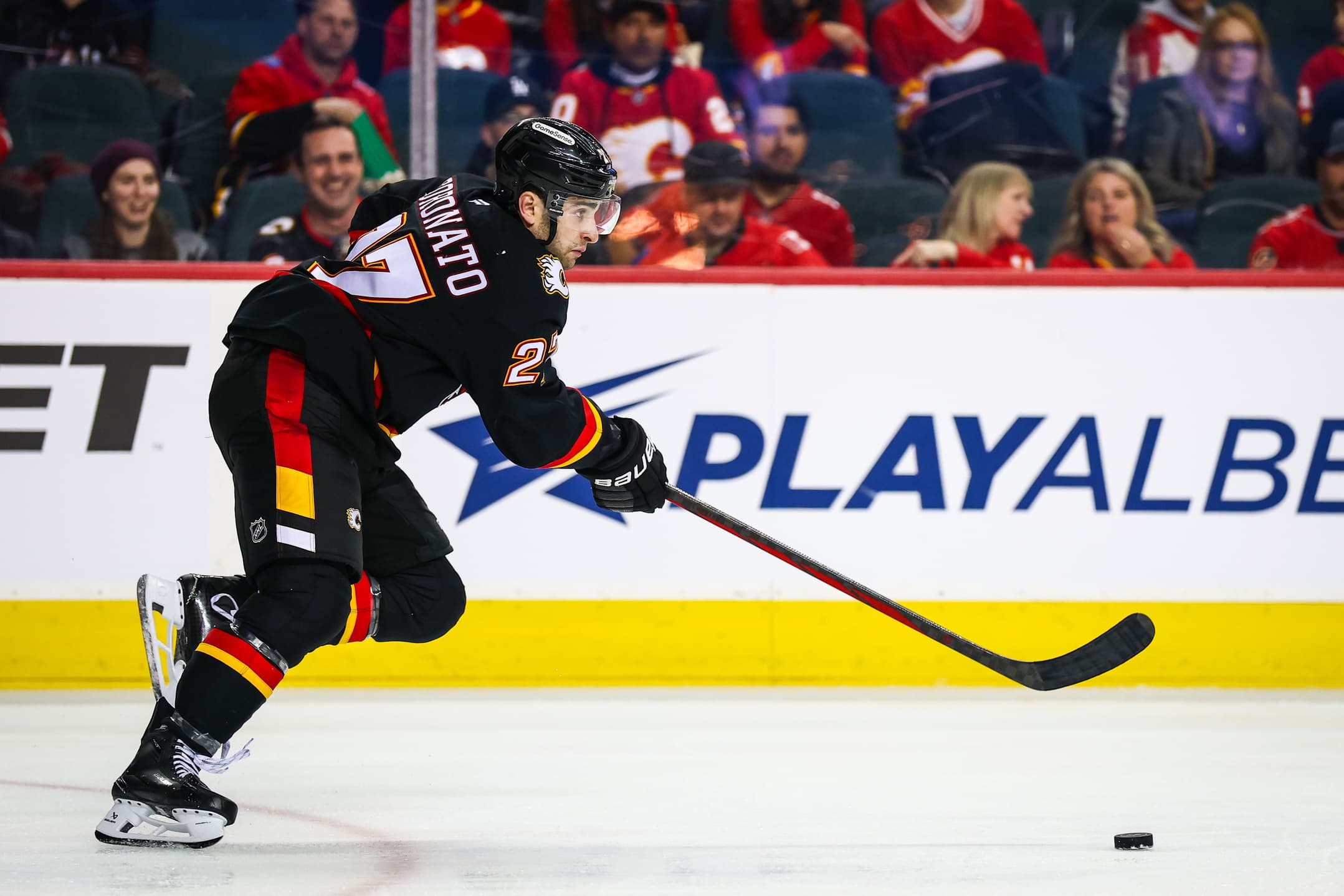 Calgary Flames right wing Matt Coronato (27) skates with the puck against the Los Angeles Kings during the third period at Scotiabank Saddledome.