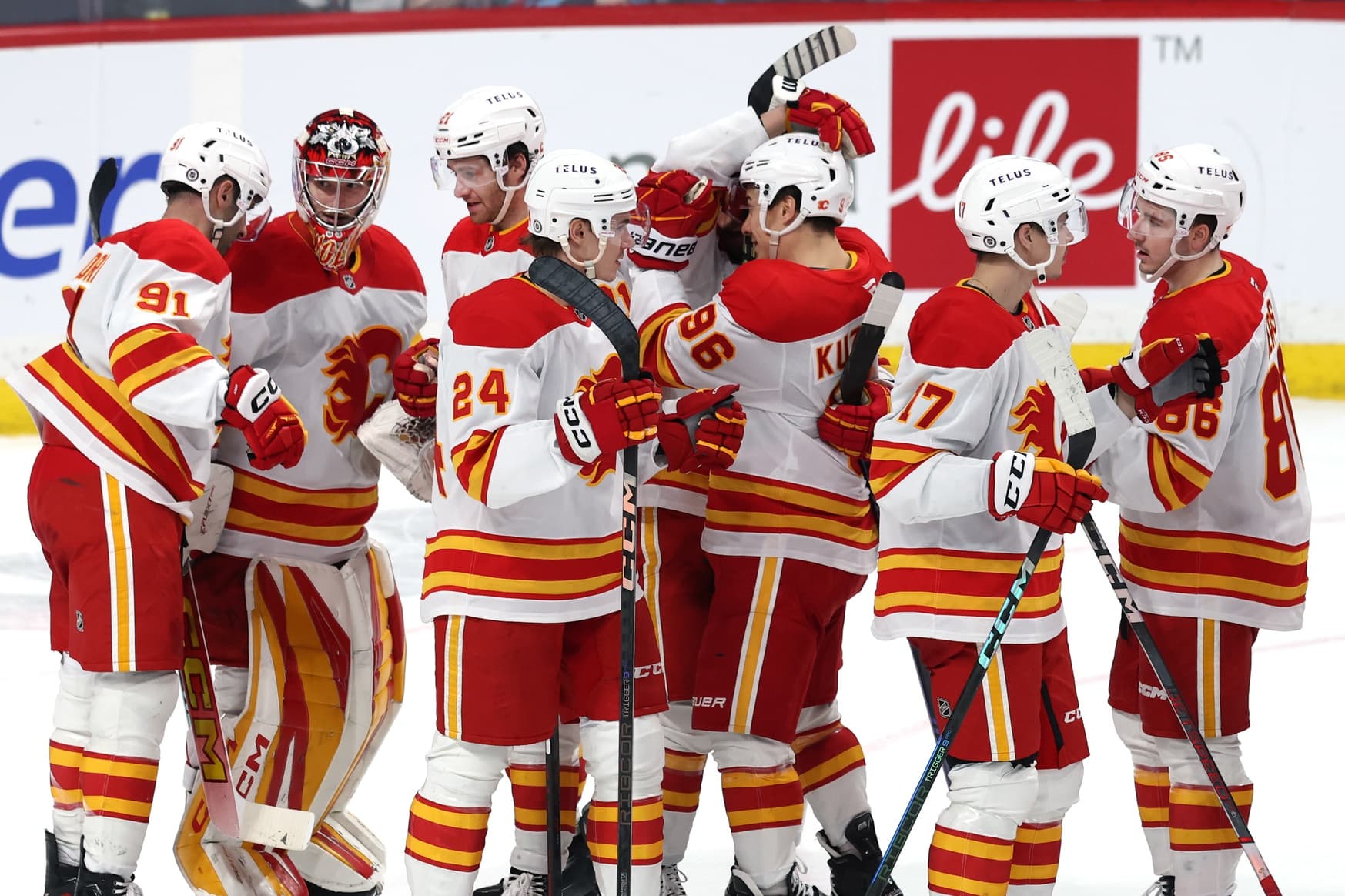 Calgary Flames players celebrate their victory over the Winnipeg Jets at Canada Life Centre.