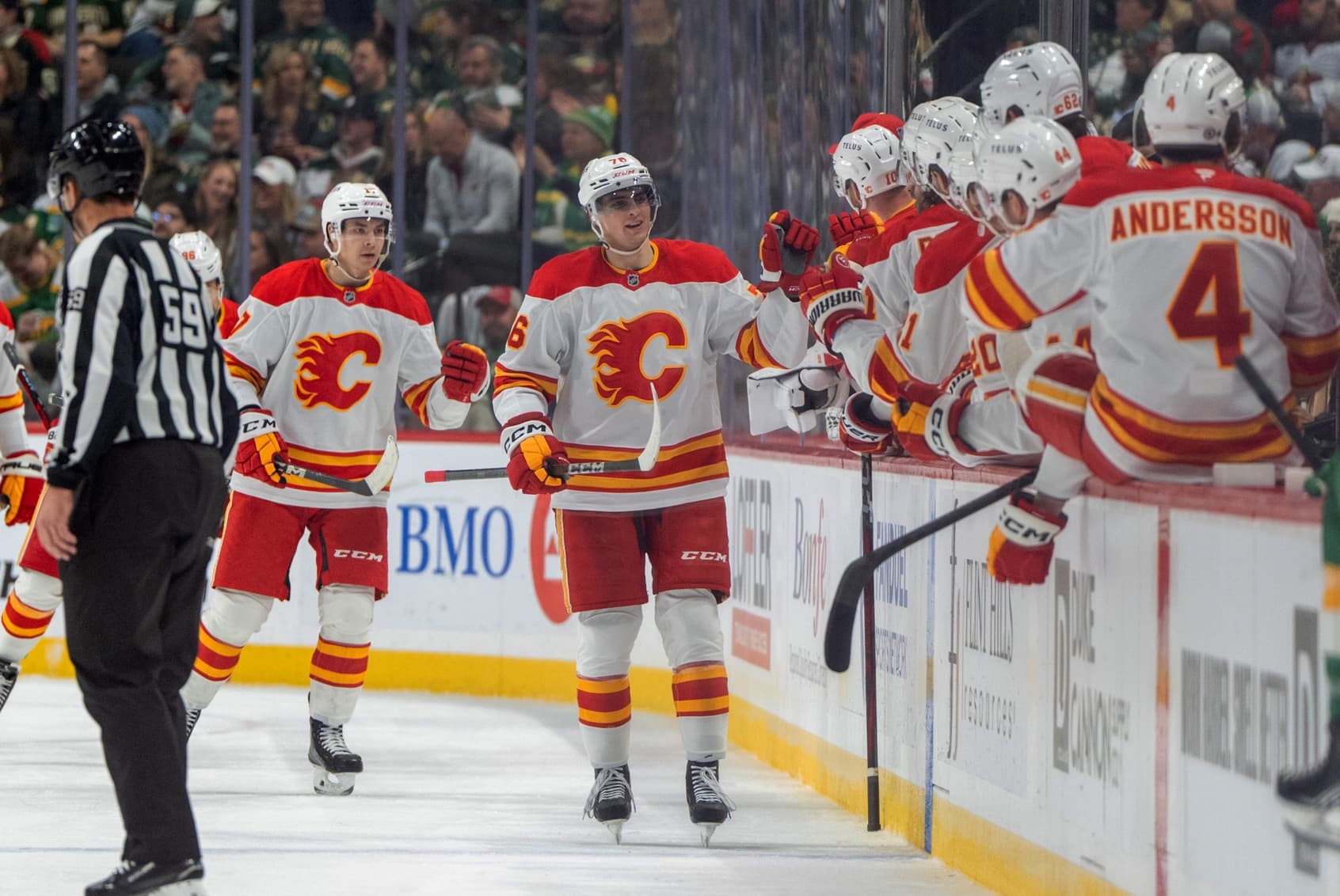 Calgary Flames center Martin Pospisil (76) celebrates with teammates after scoring against the Minnesota Wild in the second period at Xcel Energy Center.