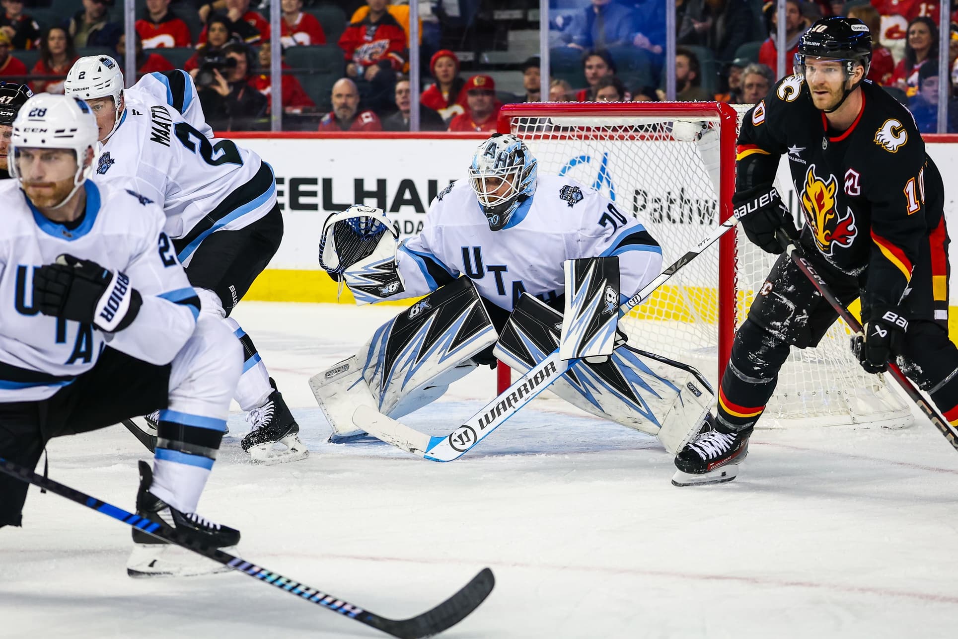 Utah Hockey Club goaltender Karel Vejmelka (70) guards his net against the Calgary Flames during the third period at Scotiabank Saddledome.