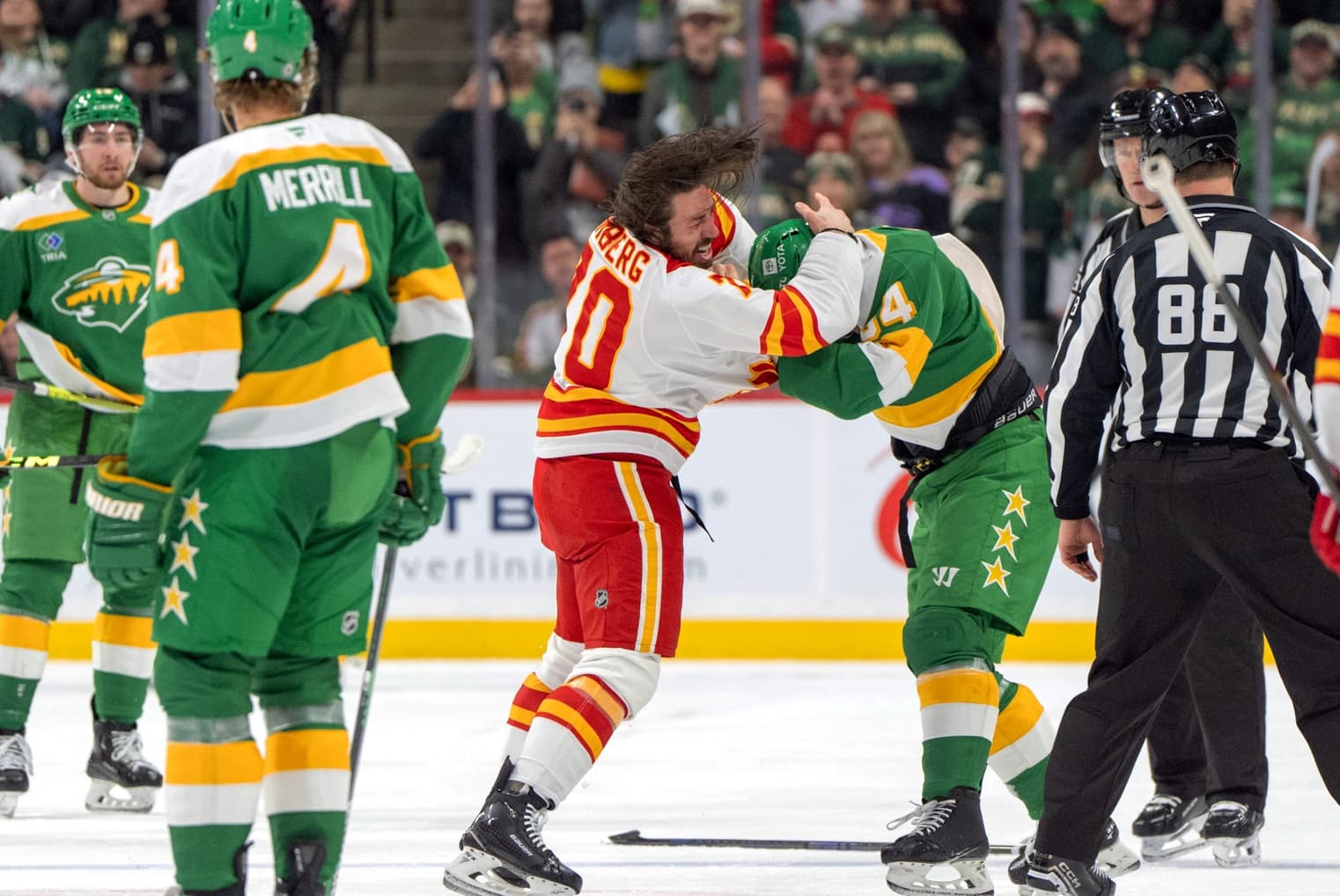 Calgary Flames left wing Ryan Lomberg (70) fights with Minnesota Wild center Jakub Lauko (94) in the second period at Xcel Energy Center.
